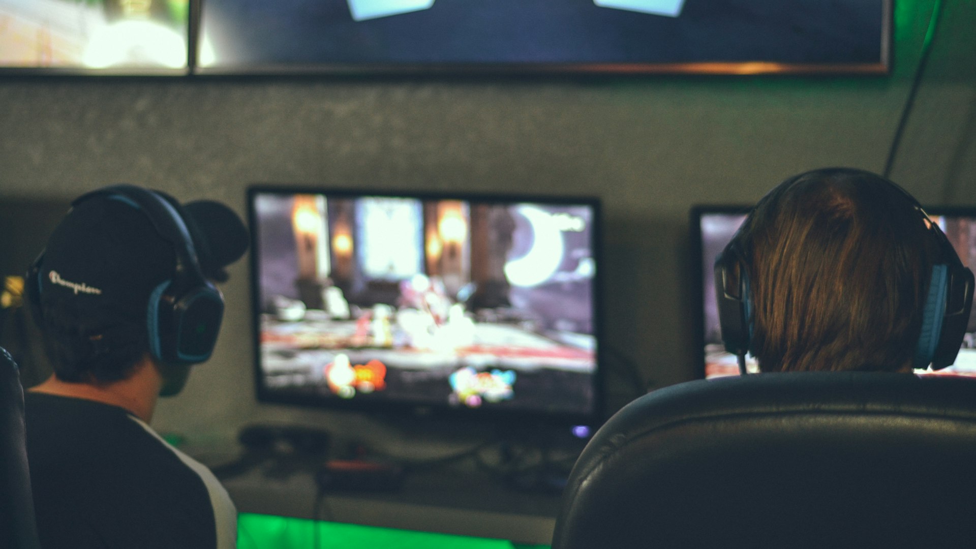 Atmospheric gaming setup bathed in emerald light